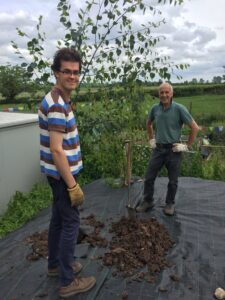 Oliver and Ian planting trees at Flower Pod