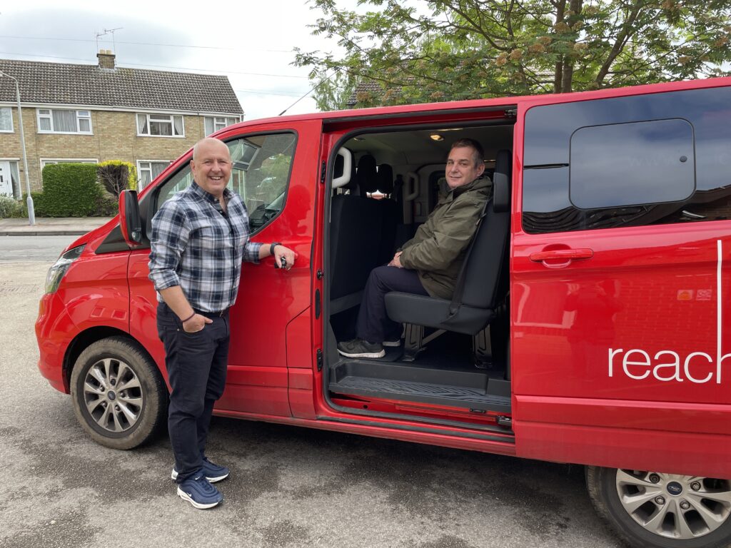 Photo of Wayne with a volunteer returning to Flower Pod enjoy a catch up