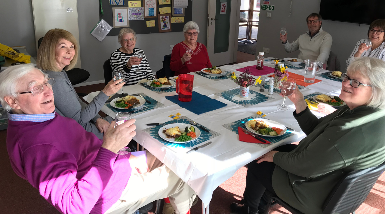 carers sharing a meal together